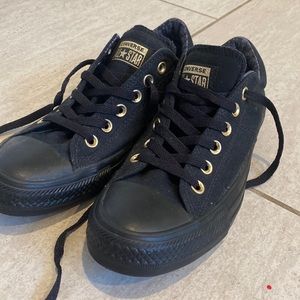 Black converse gold detail.